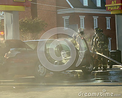 Firemen Work on Overheated Car Stock Photo