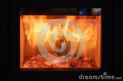 Fireplace close up, fire flame and burning wood logs, glass door fireside Stock Photo