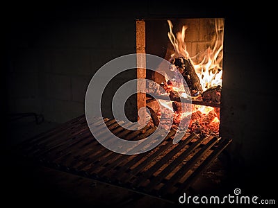 Fireplace with embers ready yet empty grid. Stock Photo