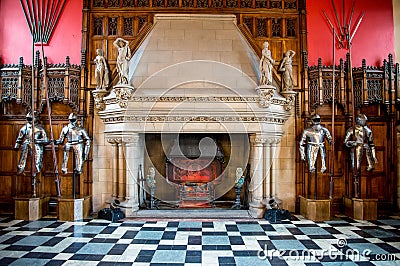 A fireplace and knight armor inside of Great Hall in Edinburgh Castle Editorial Stock Photo