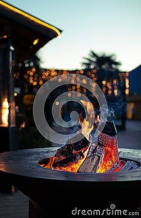 Fireplace at traditional christmas market Christkindlmarkt at Meran Merano, South Tyrol Italy Stock Photo