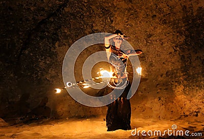 Fireshow artist dancing with fire ring Stock Photo