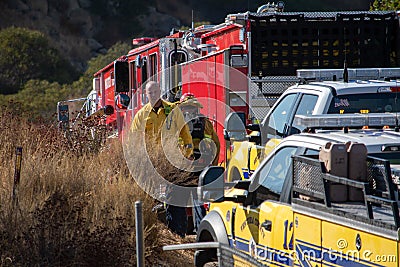 Firetrucks and crews from LACFD and VCFD arrive on scene to fight a brushfire Editorial Stock Photo