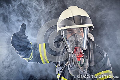 Firewoman in fire protection suit Stock Photo