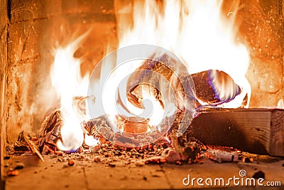 Firewood burning in fireplace fire wood heat Stock Photo