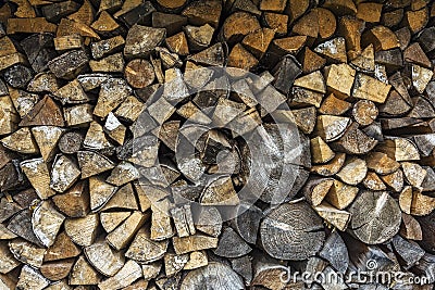 Firewood stacked in a woodpile for the winter season Stock Photo