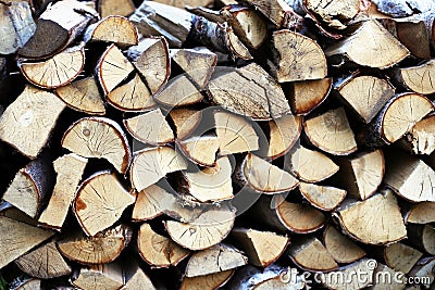 Firewood in the yard waiting for winter Stock Photo