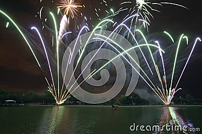 Firework display over lake Stock Photo