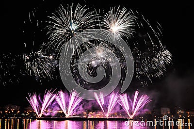 Firework over city at night Stock Photo