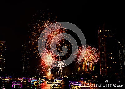 Firework show along Chao Praya River on the side of the Asiatique landmark plaza in Bangkok Editorial Stock Photo