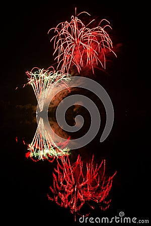 Fireworks above water, mirroring Stock Photo