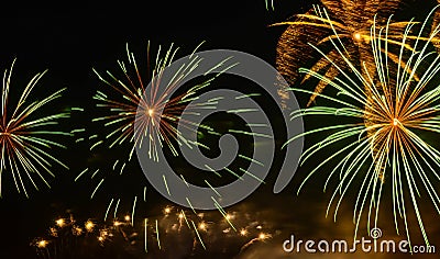 Fireworks bursts in the night sky Stock Photo