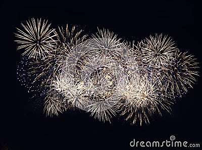 Fireworks display on dark sky background. Flashes of red and white fireworks against the night black sky. Brightly colorful Stock Photo