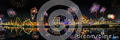 Fireworks on the river Trave. Panorama view of festive lighting with firework romantic atmosphere on the river Trave in the Hansea Editorial Stock Photo
