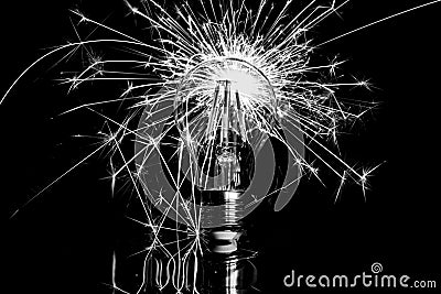 Fireworks sparkler showing through LED light bulb - black & whit Stock Photo