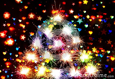 Fireworks sparks Bokeh blured on stars and hearts dark background Stock Photo