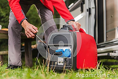 Firing Up Gas Powered Portable Inverter Generator Stock Photo