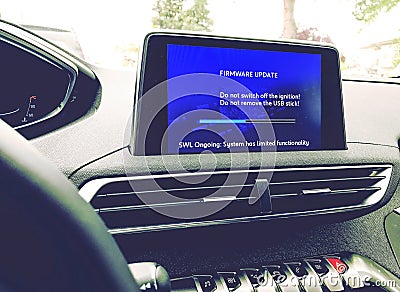 Firmware update on a modern car Stock Photo