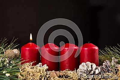 First advent candle burning Stock Photo