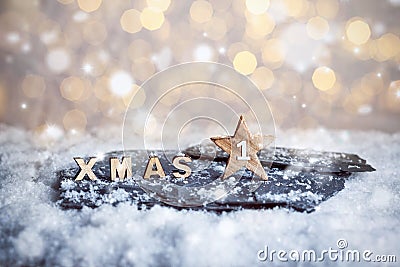 First Advent Sunday and wooden XMAS letters in snow Stock Photo