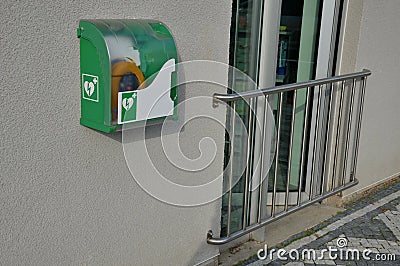 First aid AED defibrillator wall mounted storage Stock Photo