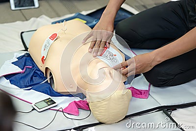 First aid cardiopulmonary resuscitation course using AED training. Stock Photo