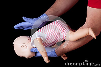 First aid for choking infant Stock Photo