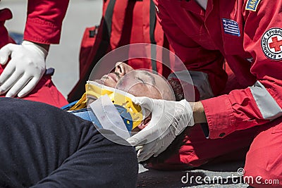 First aid, victim liberation in an car accident Editorial Stock Photo