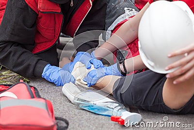 Work accident. First aid training. Arm injury. Stock Photo