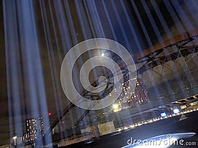 First Breath installation, Manchester beams of light going upward into sky with moon and bridge Editorial Stock Photo