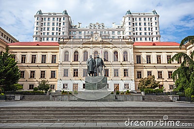 The first experimental public school in Tbilisi, classic gymnasium, statue of Ilia Chavchavadze and Akaki Tsereteli Stock Photo