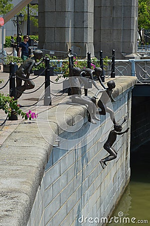 First Generation Statue by the Singapore River, Downtown Singapore Editorial Stock Photo