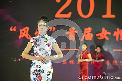 Red strawberry-Female cheongsam show Editorial Stock Photo