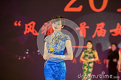 Cloisonne-Female cheongsam show Editorial Stock Photo