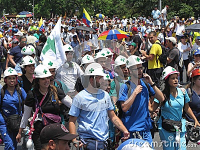 First responders known as White helmed, green crosses during main protest in Caracas Venezuela Editorial Stock Photo