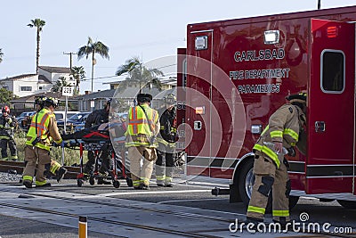 First responders transport crash victim to ambulance Editorial Stock Photo