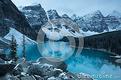 First snow Morning at Moraine Lake in Banff National Park Alberta Canada Snow-covered winter mountain lake in a winter atmosphere. Stock Photo