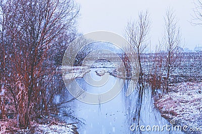 First snow over the brook. Beautiful wilderness Stock Photo