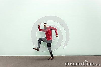 First step in career. Young adult bearded businessman walking Stock Photo