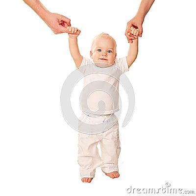 First steps. Baby learning to walk, Stock Photo