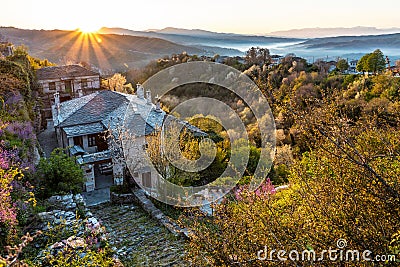 First sun rays on the picturesque village of Vitsa in Zagori area, Northern Greece Stock Photo