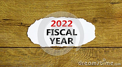 2022 fiscal new year symbol. Words `2022 fiscal year`, on white paper. Beautiful wooden background. Business and 2022 fiscal new Stock Photo