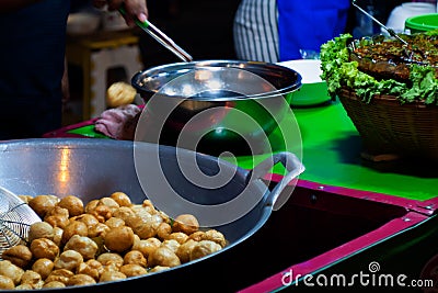 Fish Ball Fry in a frying pan with hot oil. in Thailand street food Stock Photo