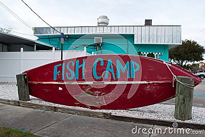 Fish Camp sign on Red Boat Stock Photo