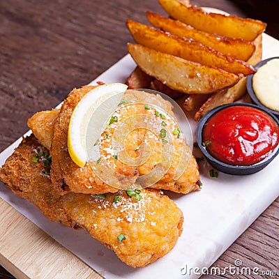 Fish and chips with potato wedge Stock Photo