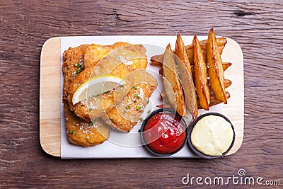 Fish and chips with potato wedge Stock Photo