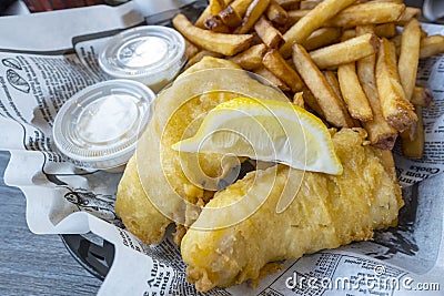 Fish & Chips Served with Fries Stock Photo