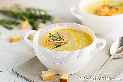 Fish cream soup with Salmon, cheese, Potatoes and herbs Stock Photo