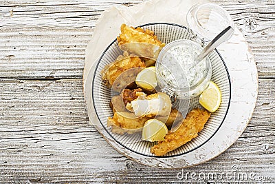 Fish dish - Cod in beer batter with tar tar sauce for a healthy and comfortable diet Stock Photo
