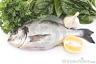 Fish dorade with swiss chard, parsley, garlic and lemon Stock Photo